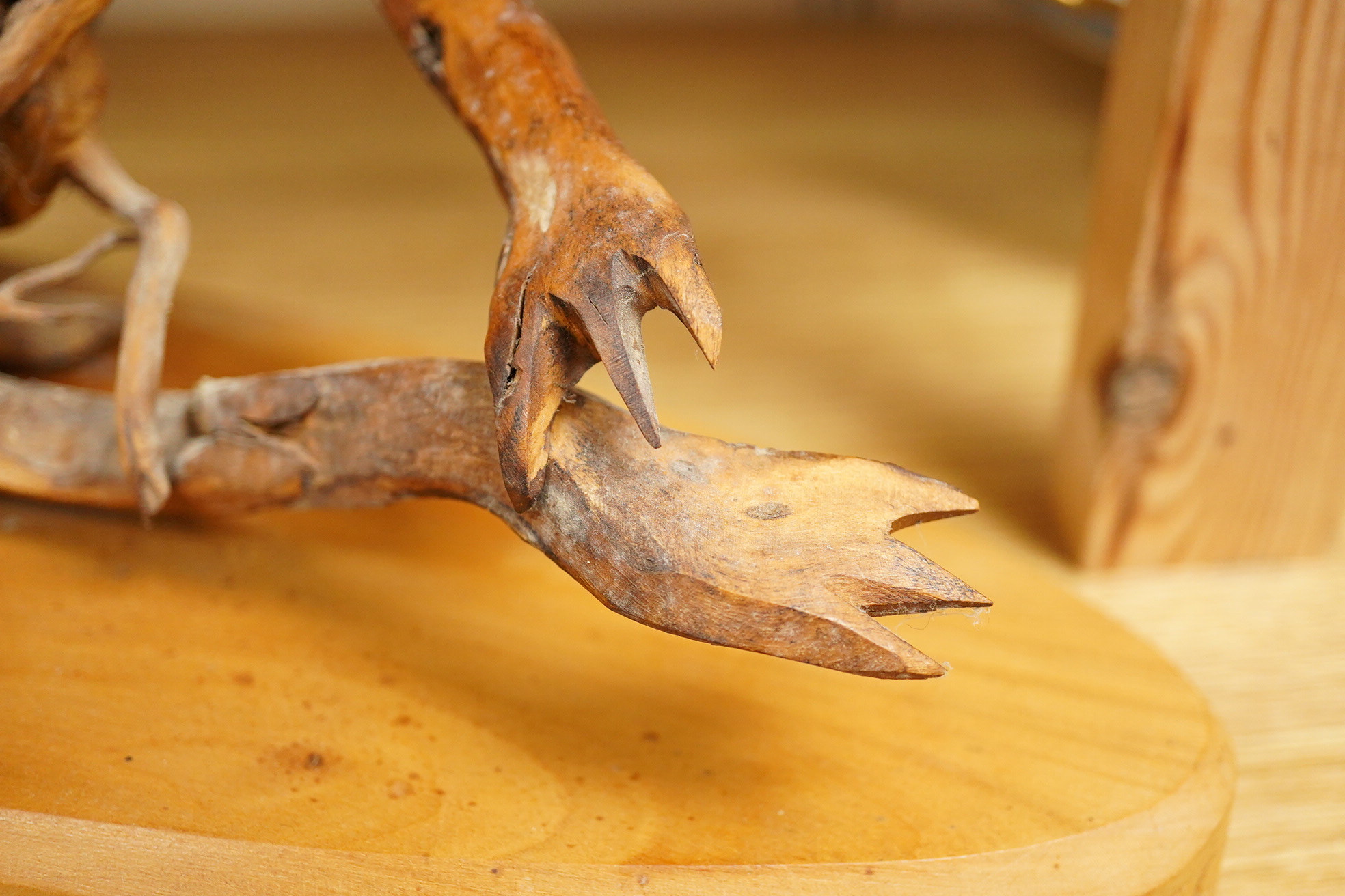 Pierre Decorse (b.1953), a wooden sculpture of a reclining frog-like figure, base 34cms long